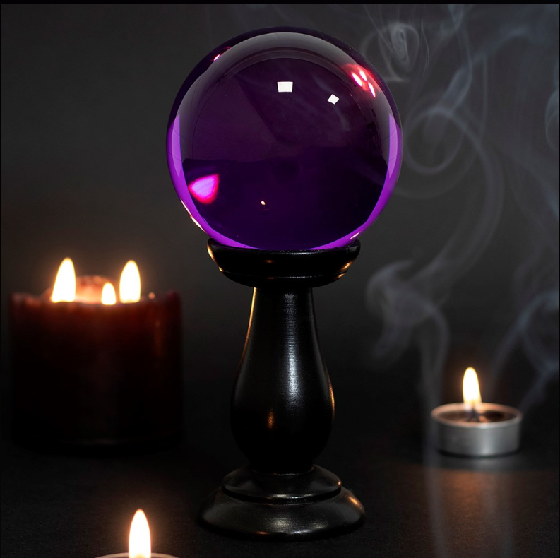 Small purple crystal ball on black wooden stand, gothic witchy home décor