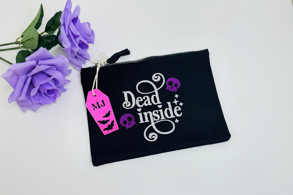 Dead Inside gothic makeup bag with purple glitter skulls and silver lettering
