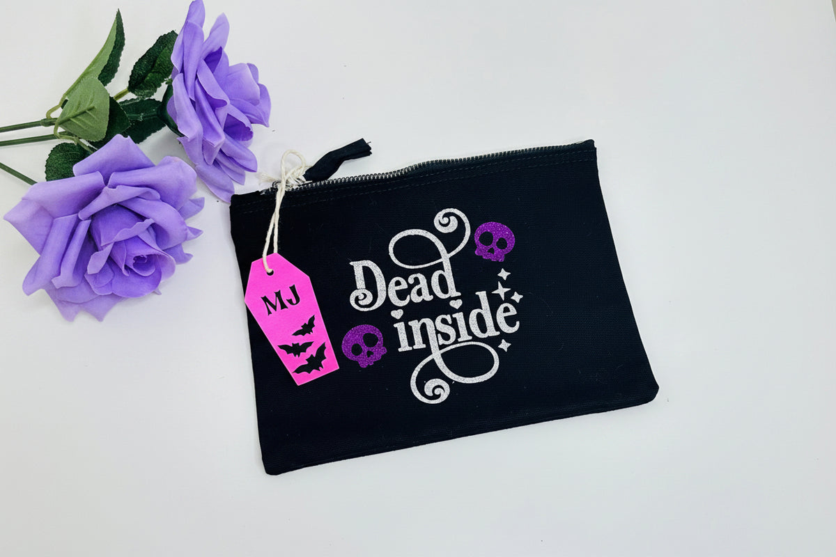 Dead Inside gothic makeup bag with purple glitter skulls and silver lettering