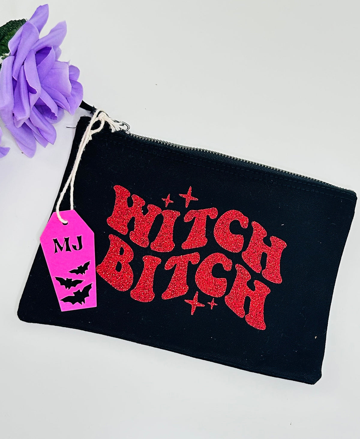 Witchy gothic makeup bag with red glitter witch bitch lettering on black canvas