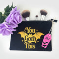 You Goth This gothic makeup bag with black base and orange glitter accents