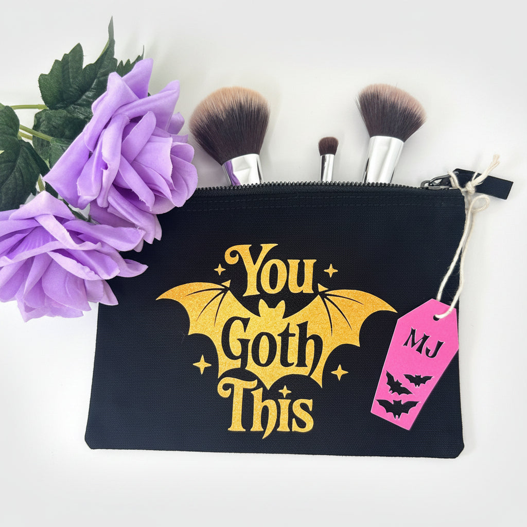 You Goth This gothic makeup bag with black base and orange glitter accents