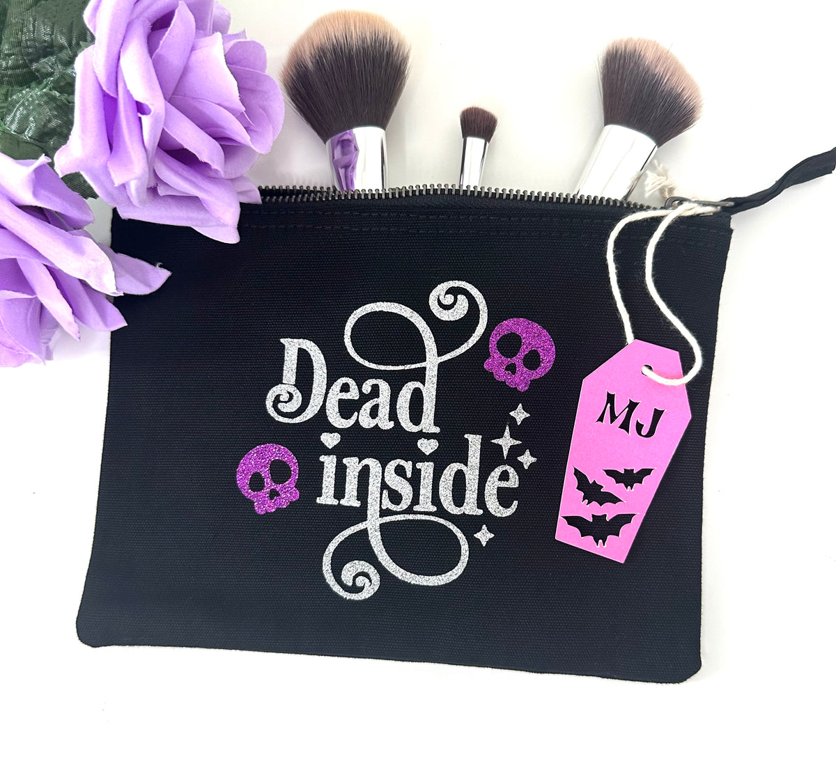 Dead Inside gothic makeup bag with purple glitter skulls and silver lettering