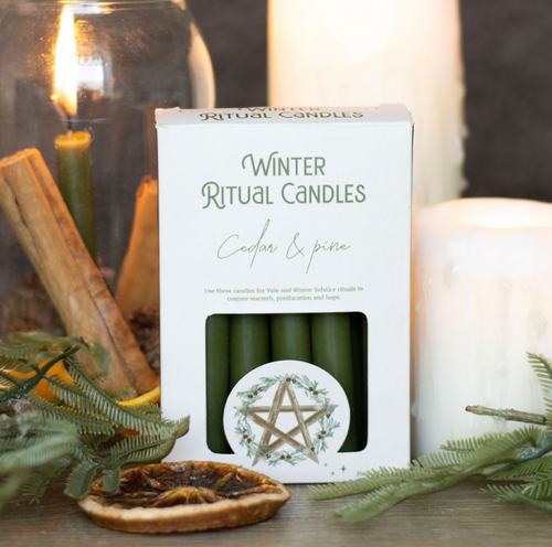 Cedar and pine winter ritual spell candles with pentagram motif