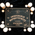 Black wooden talking board with gold celestial engravings and planchette, by MJ Gothic Gifts