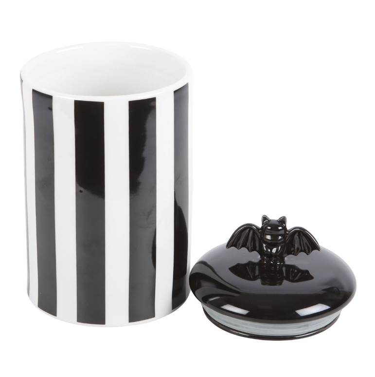 Black-and-white striped ceramic bat storage jar with a lift-off bat-detail lid.