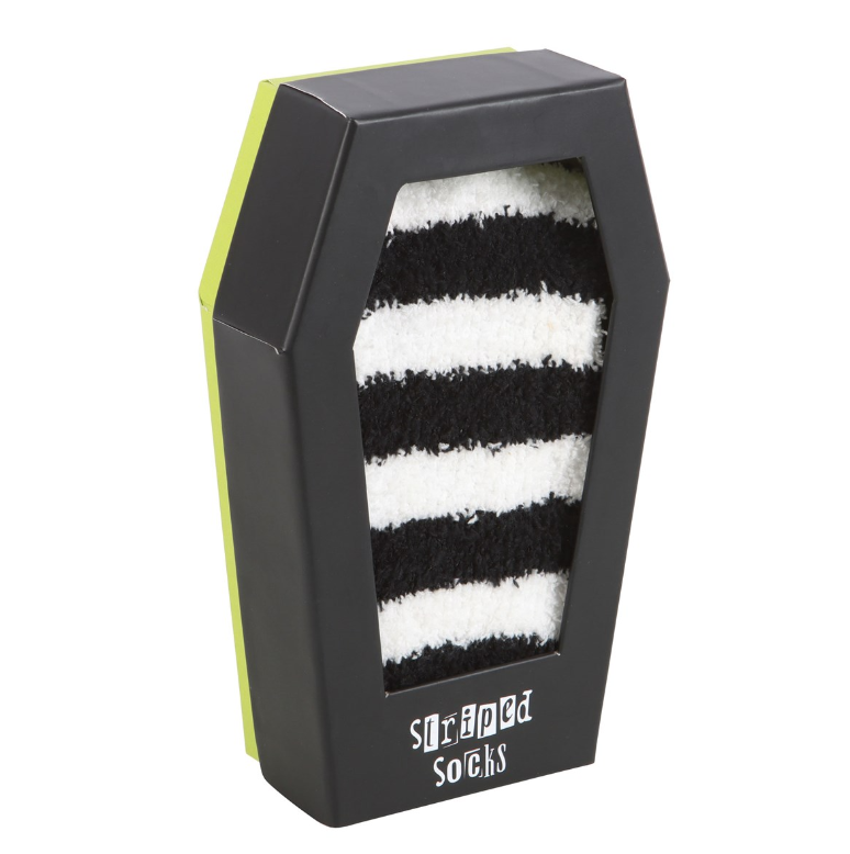Fluffy black and white striped socks in a coffin-shaped gift box