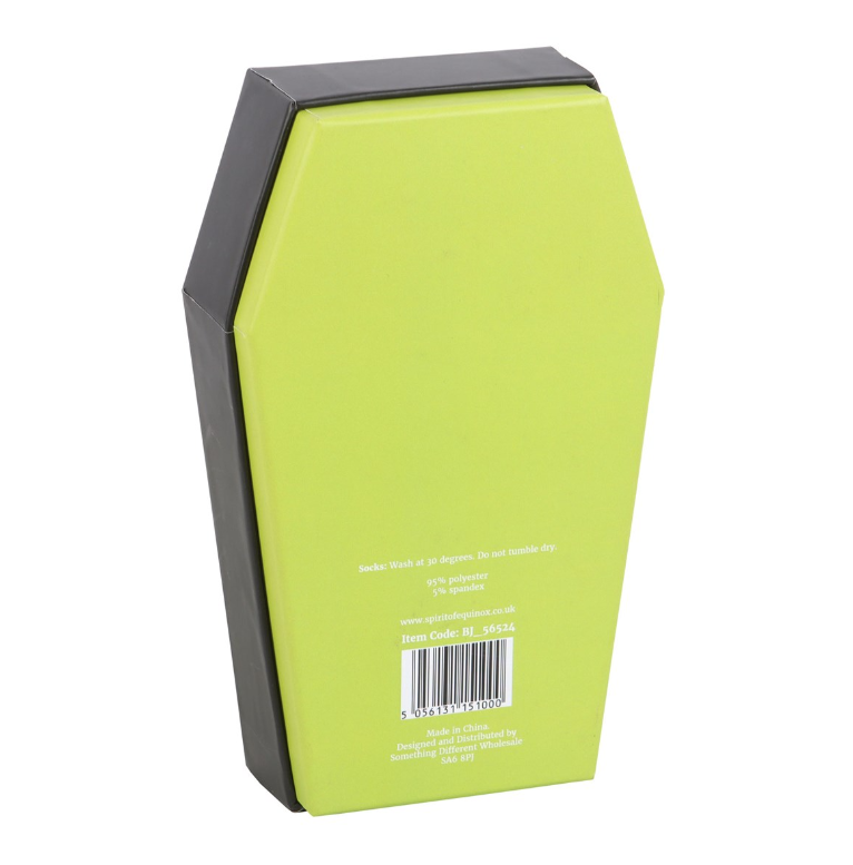 Fluffy black and white striped socks in a coffin-shaped gift box
