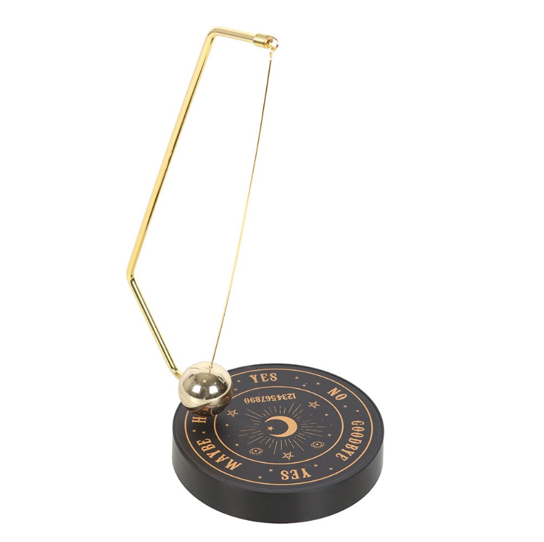 Talking board pendulum decision maker with triangular gold wire frame and silver ball pendulum on black matte celestial base