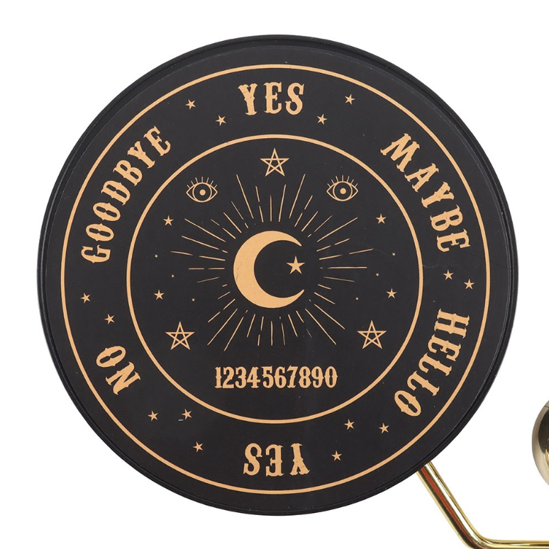 Talking board pendulum decision maker with triangular gold wire frame and silver ball pendulum on black matte celestial base