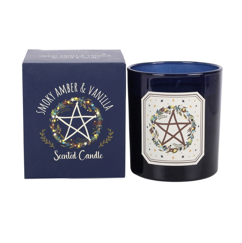 Smoky Amber and Vanilla Solstice Wreath scented candle in glossy navy glass jar with matching navy gift box showing pentagram wreath design