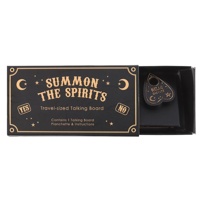 Mini black and gold ouija talking board and teardrop planchette inside open matchbox-style gift box