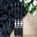 Set of 3 black taper candles with a mystical moon phase design