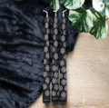 Set of 3 black taper candles with a mystical pentagram design
