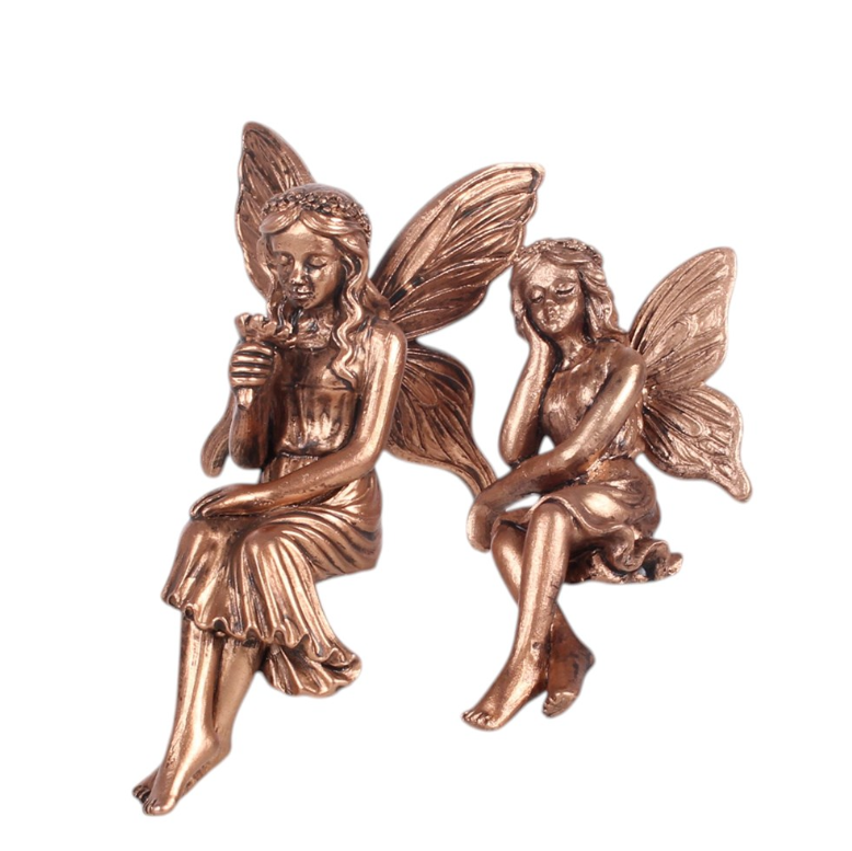 Set of 2 bronze-effect resin fairy shelf sitter ornaments displayed on a shelf
