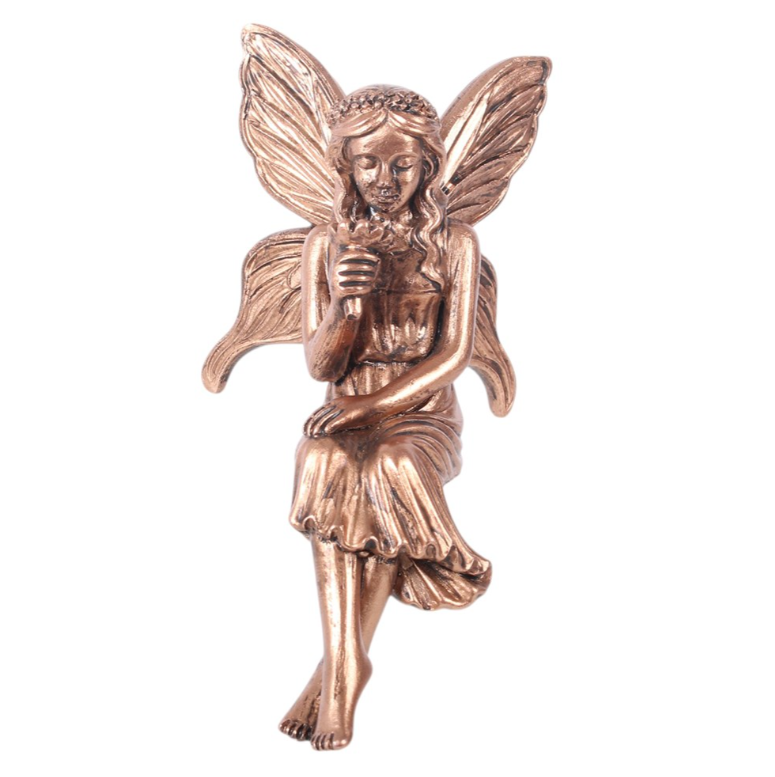Set of 2 bronze-effect resin fairy shelf sitter ornaments displayed on a shelf