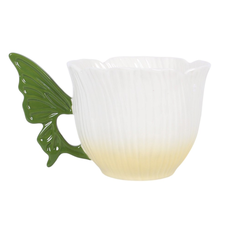 Flower-shaped ceramic teacup with green fairy wing handle.