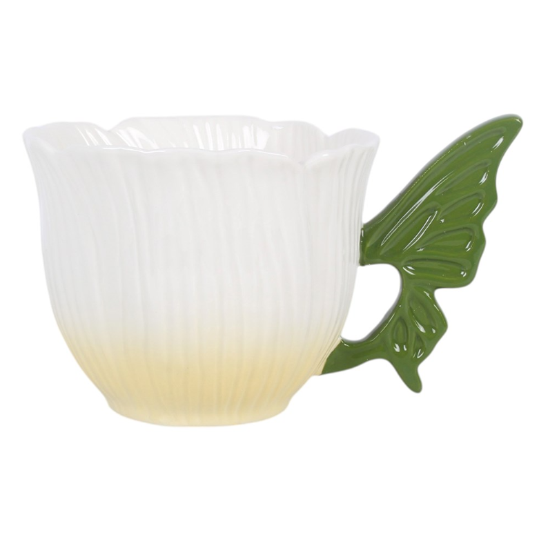 Flower-shaped ceramic teacup with green fairy wing handle.