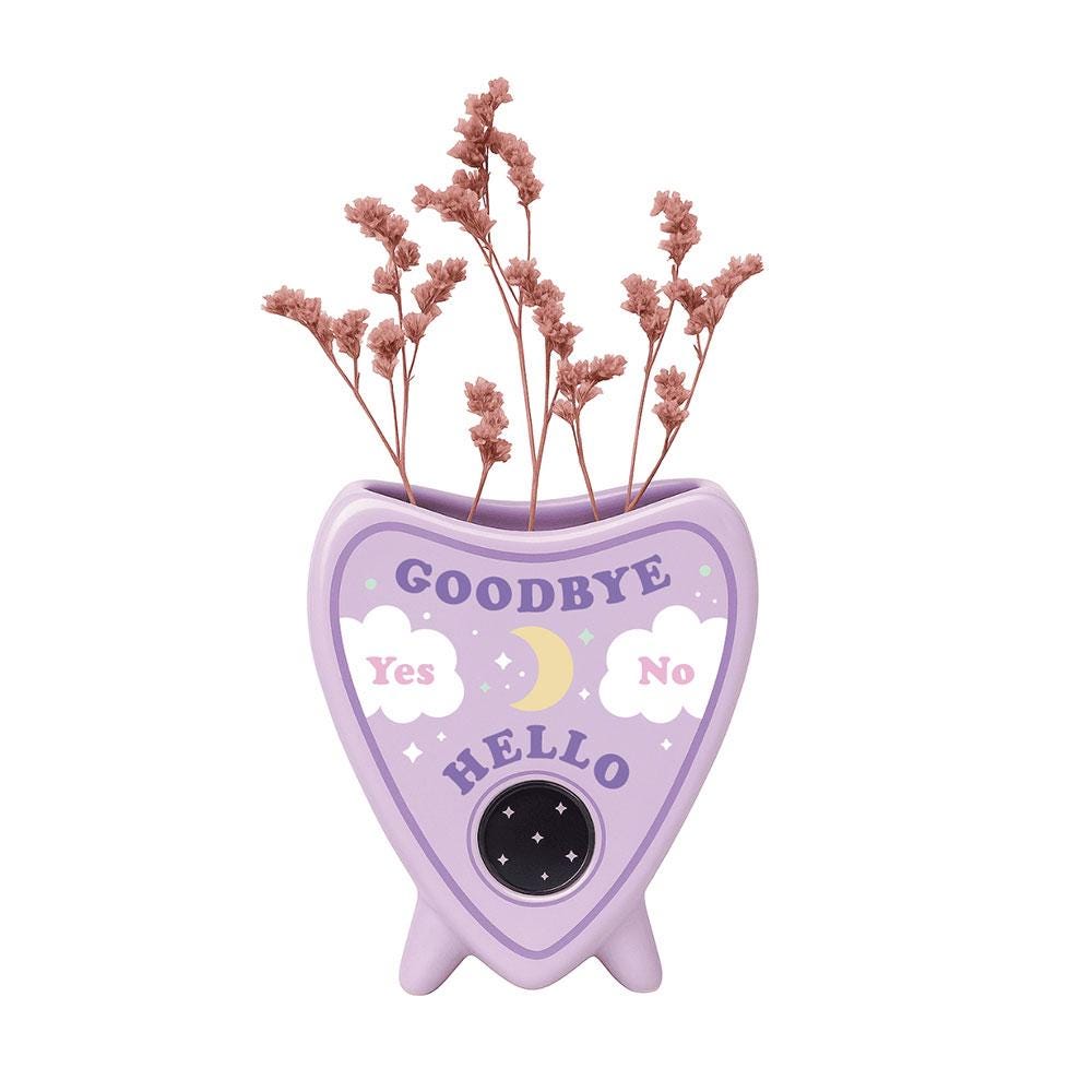 Pastel planchette shaped ceramic flower vase with celestial talking board design