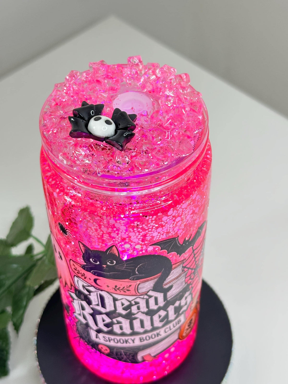 Gothic book lover snow globe tumbler with spooky cat and pink glitter
