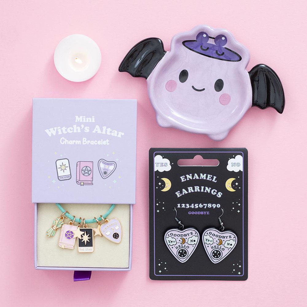 Pastel talking board planchette earrings with celestial details spooky cute jeweller